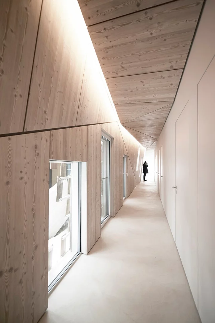 The interior of the home features a series of rooms which run off a long corridor