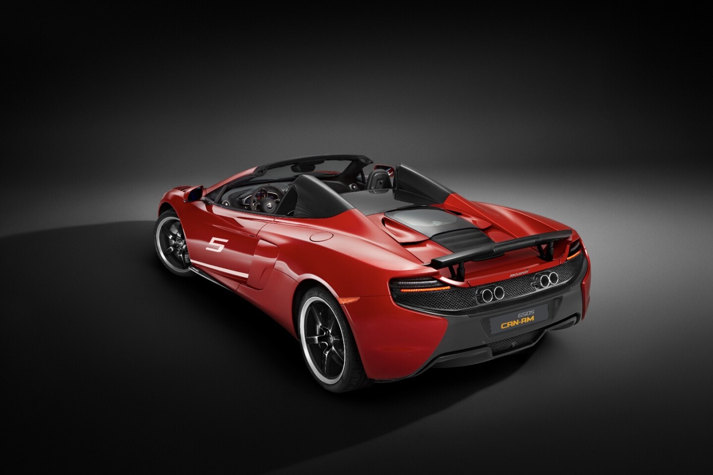 Those quad exhaust pipes are a throwback to the Can Am racers of the 1960s