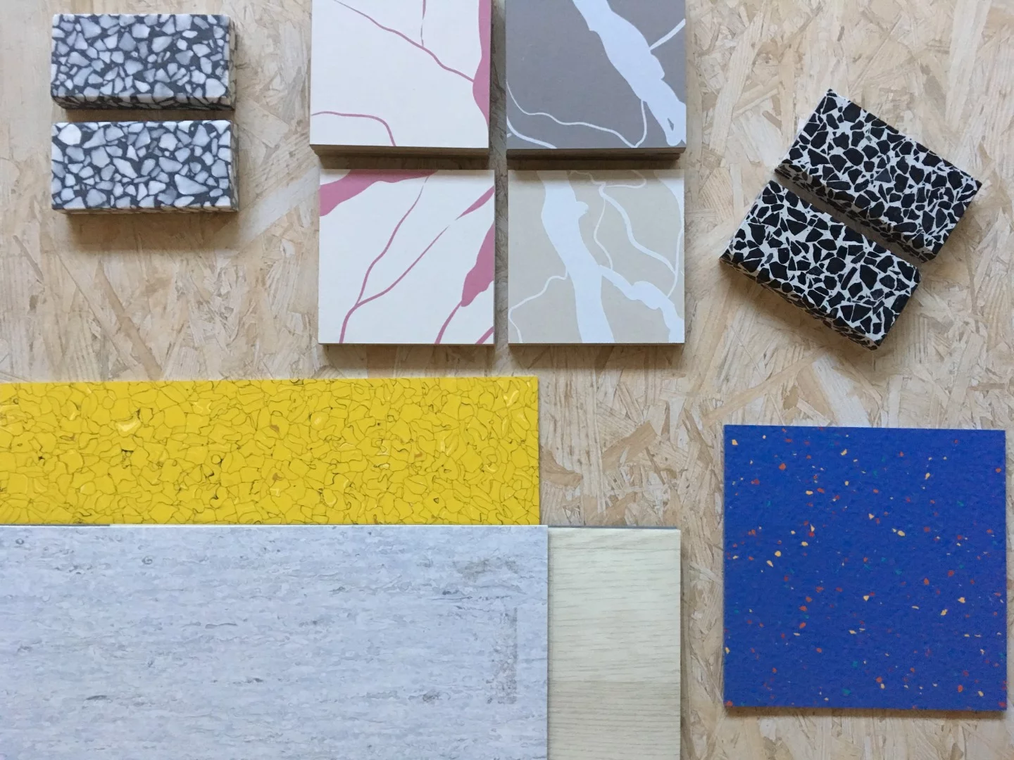 The interior design boasts a mix of classic and non-traditional materials, including natural wood, marble, painted tiles and vinyl