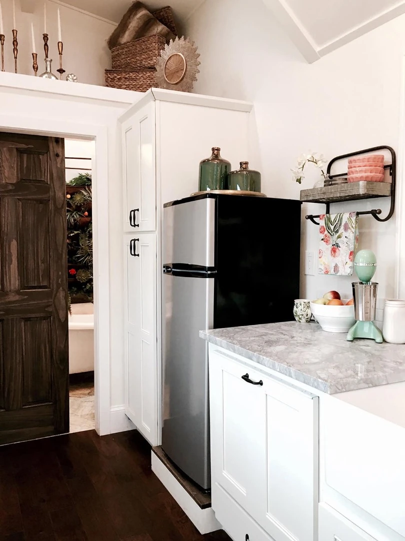 The Vintage Glam's kitchen also includes a refrigerator