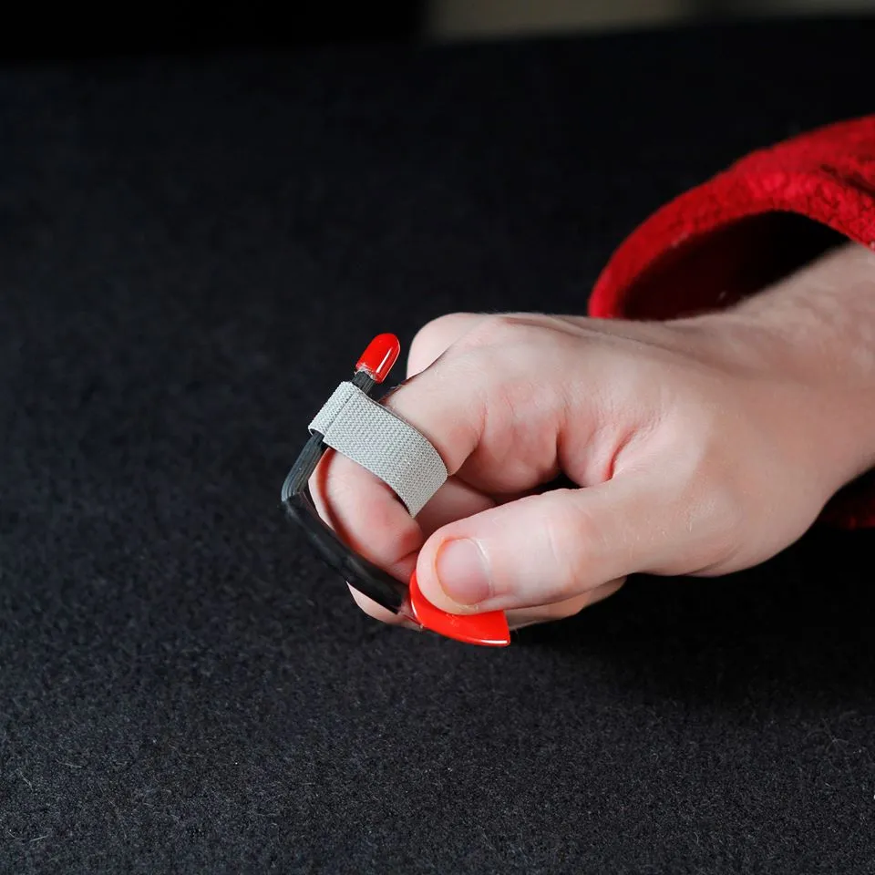The Pick Slinger lets players grip a plectrum and then flick it out of the way when in the mood for neck tapping or finger picking