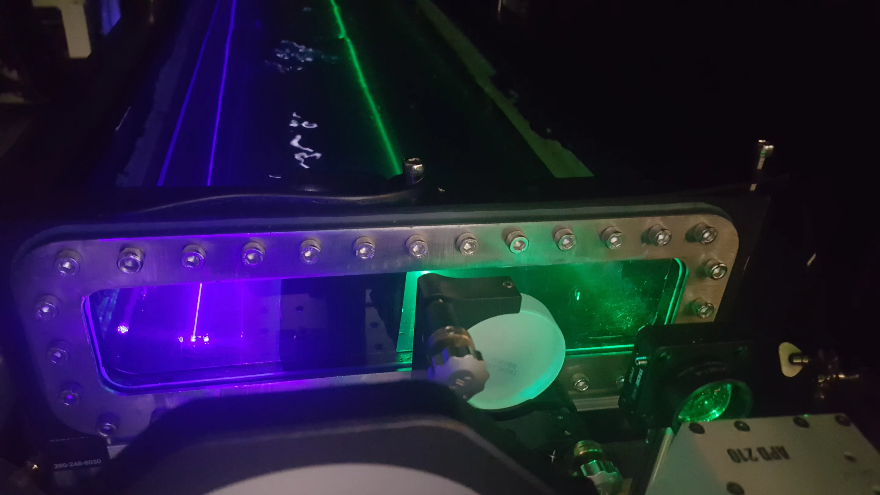 The UWOC setup in the lab, with its green downlink channel and blue uplink channel