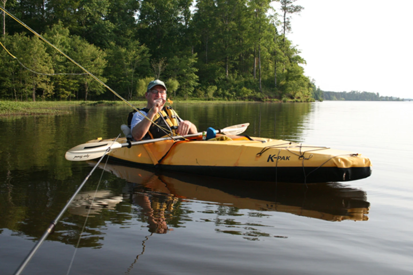 Backpackable boat unfolds and inflates into paddling form