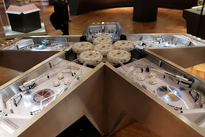 Andy Cavatorta's multi-player Dual Coincidence game incorporates five pinball playfields, joined to one another at the head