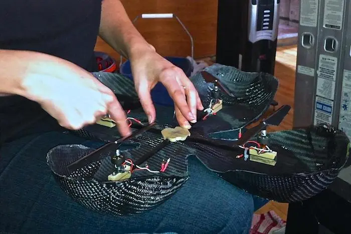 To enhance the robustness of the craft, a carbon fiber ribbon has been designed to protect the rotors and electronics in the event of a crash landing