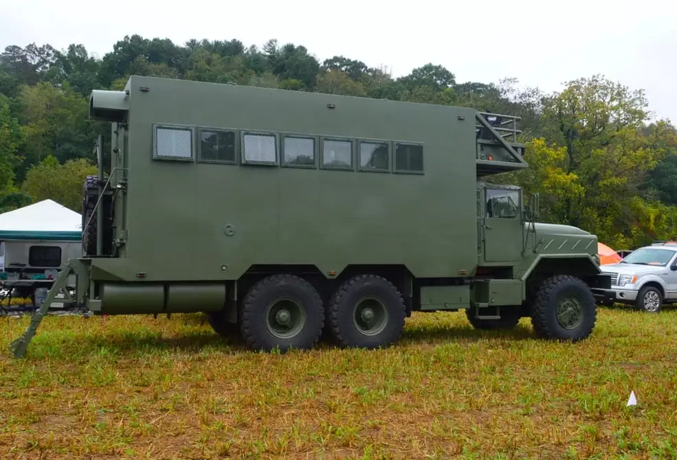 The Bravo 1 is a 1990 military flatbed truck converted into a large, 6x6 motorhome