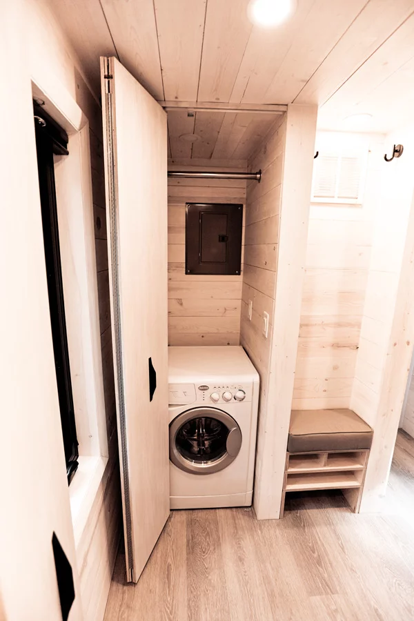 The Draper's washer/dryer is stored within a cupboard