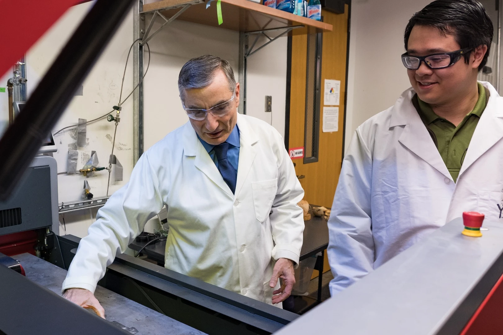 James Tour (left) and co-author Yieu Chyan preparing a sample in an industrial laser