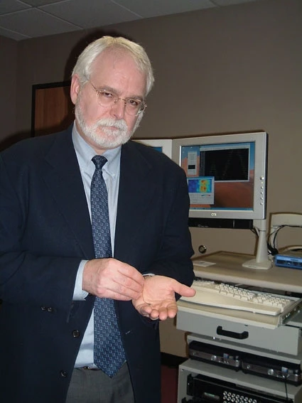 John Anderson holdingthe BrainGate array
