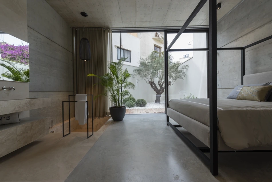 Casa B's ground floor includes a bedroom and bathroom that opens onto a small garden