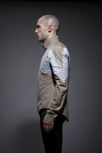 The jacket is made of organic cotton with additional water-resistant layers that we gather do not sacrifice the jacket's breathability