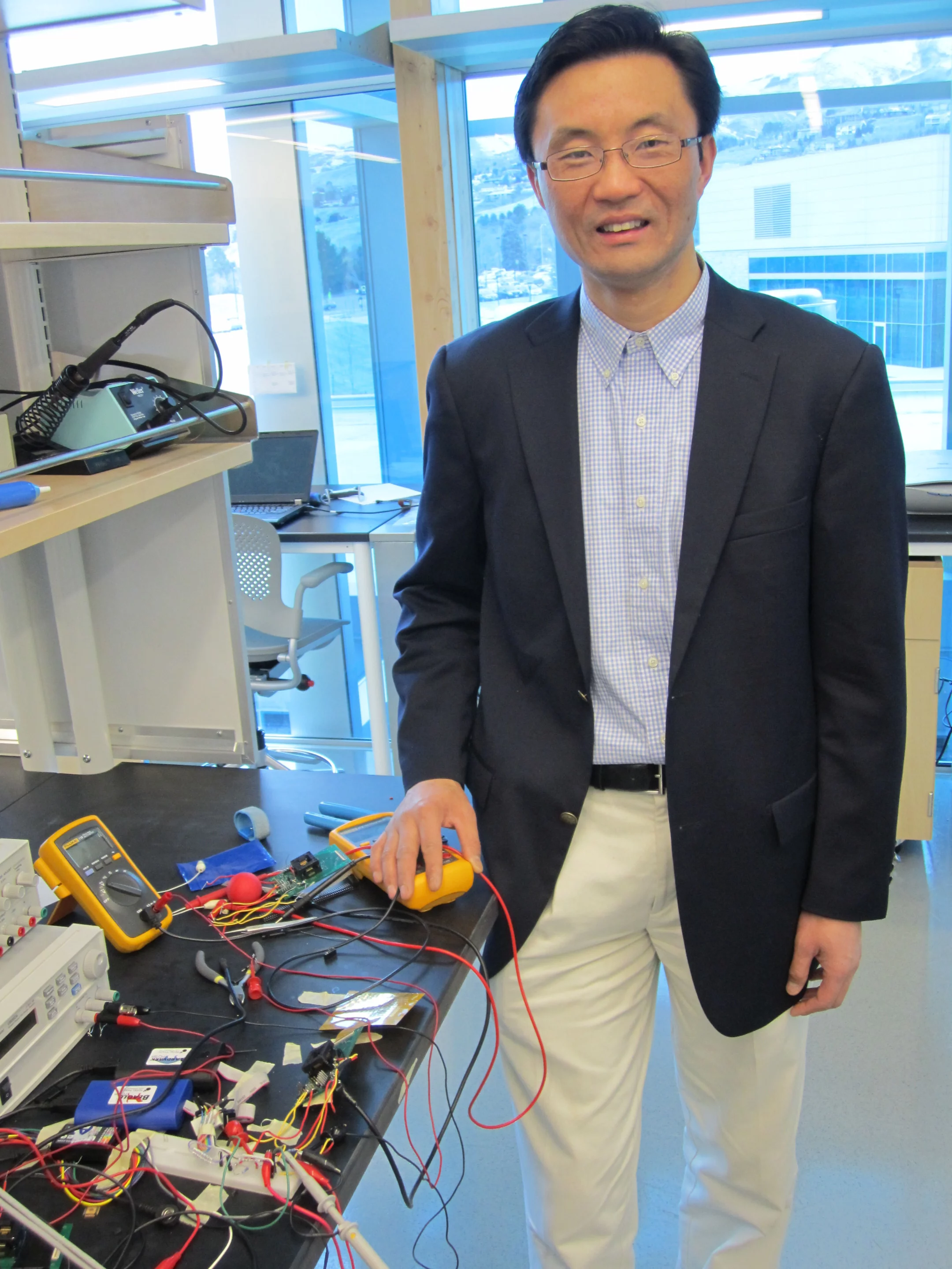 University of Utah electrical engineer Darrin Young developed the tiny prototype microphone (Photo: Lee J. Siegel, University of Utah)