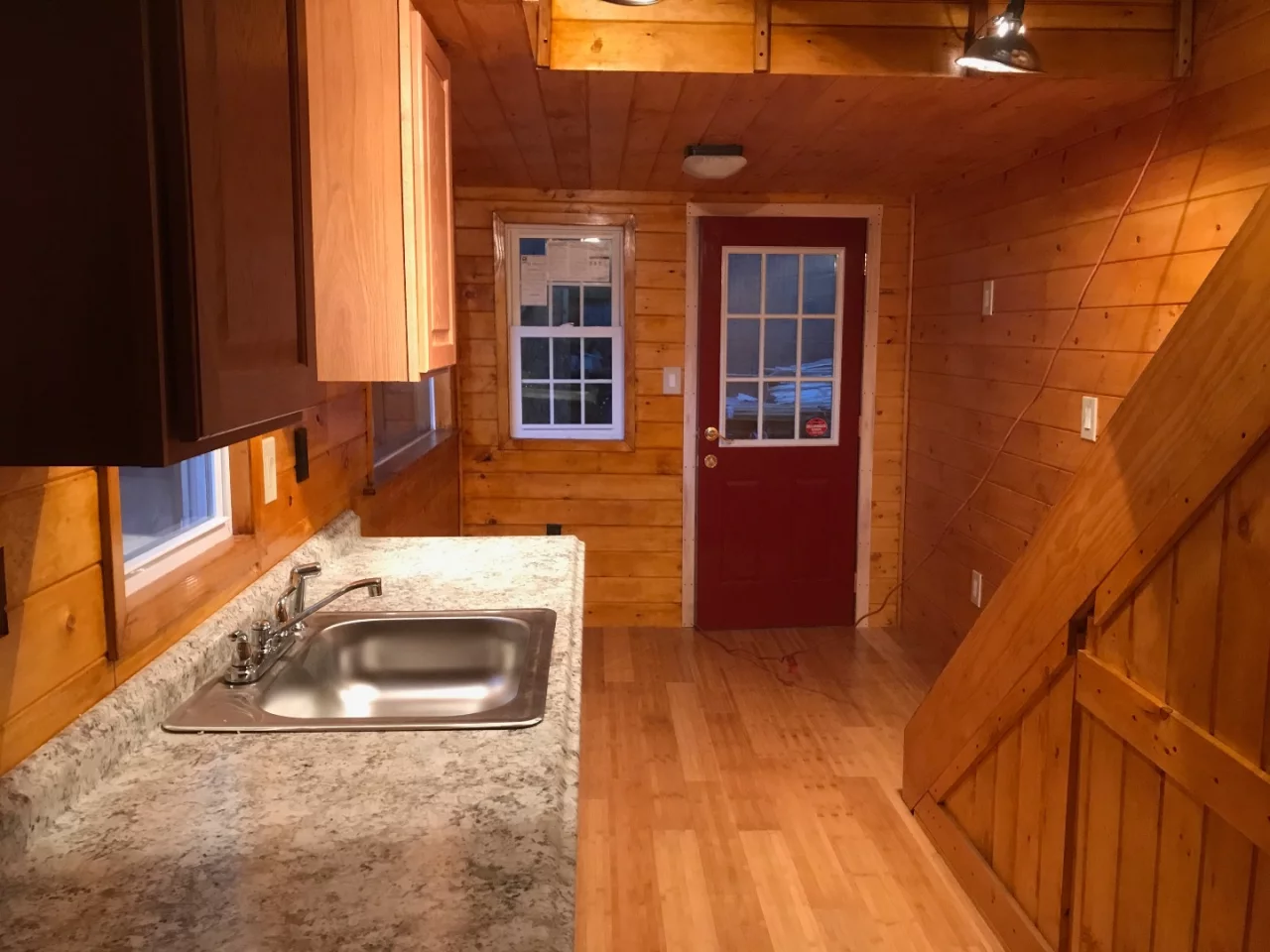 The Devasa's interior includes a snug living room area, a kitchen and a bathroom