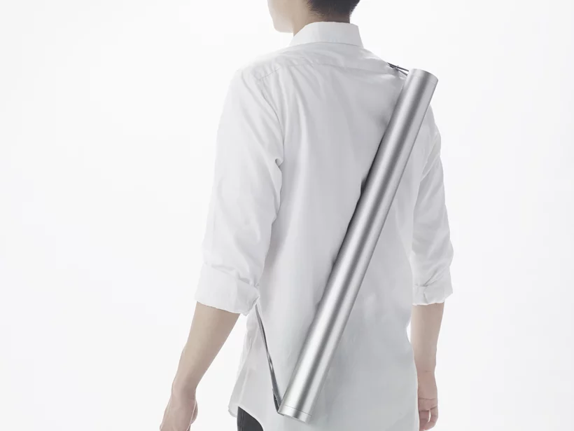 The MINIM+AID kit is housed in a 5 cm (2 in) thick metal tube that is waterproof, can float, and can be worn around the shoulder and easily stored