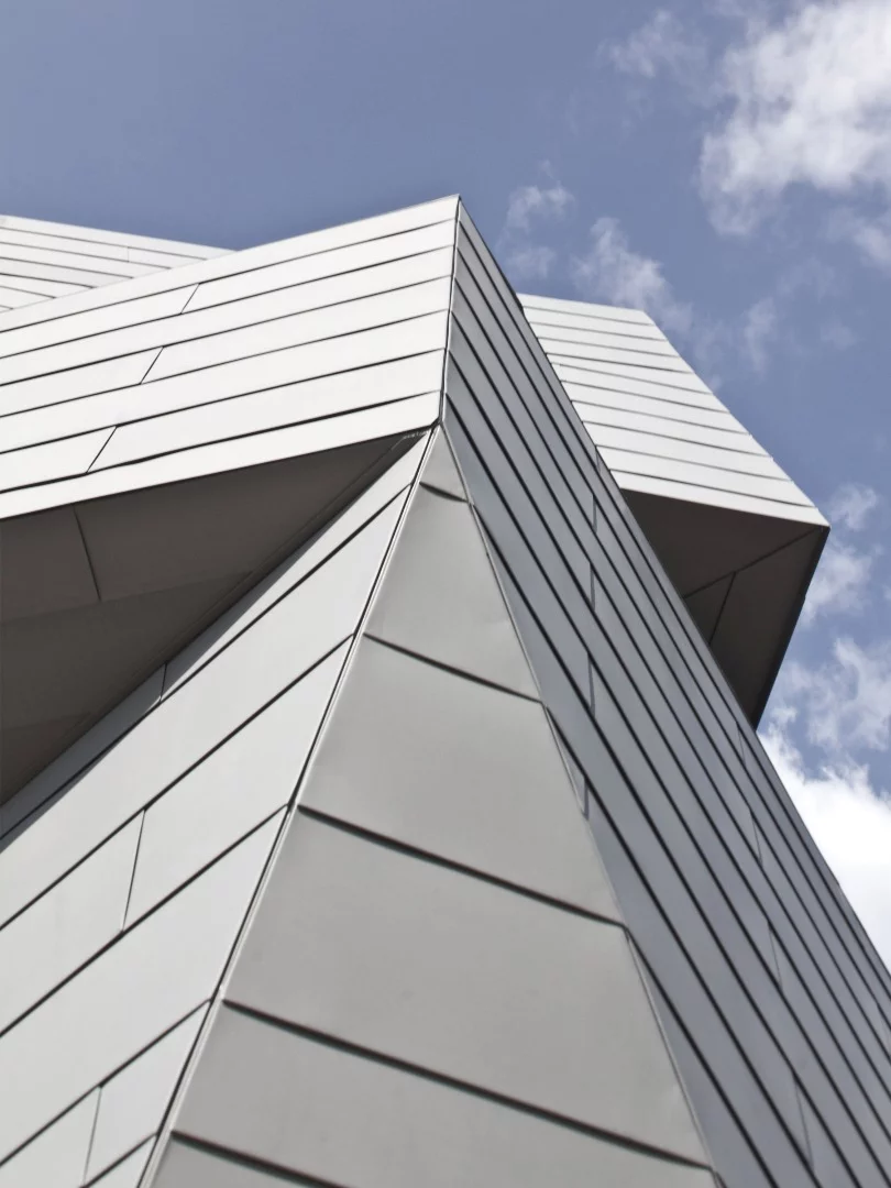The zinc cladding is designed to reflect the surrounding granite landscape