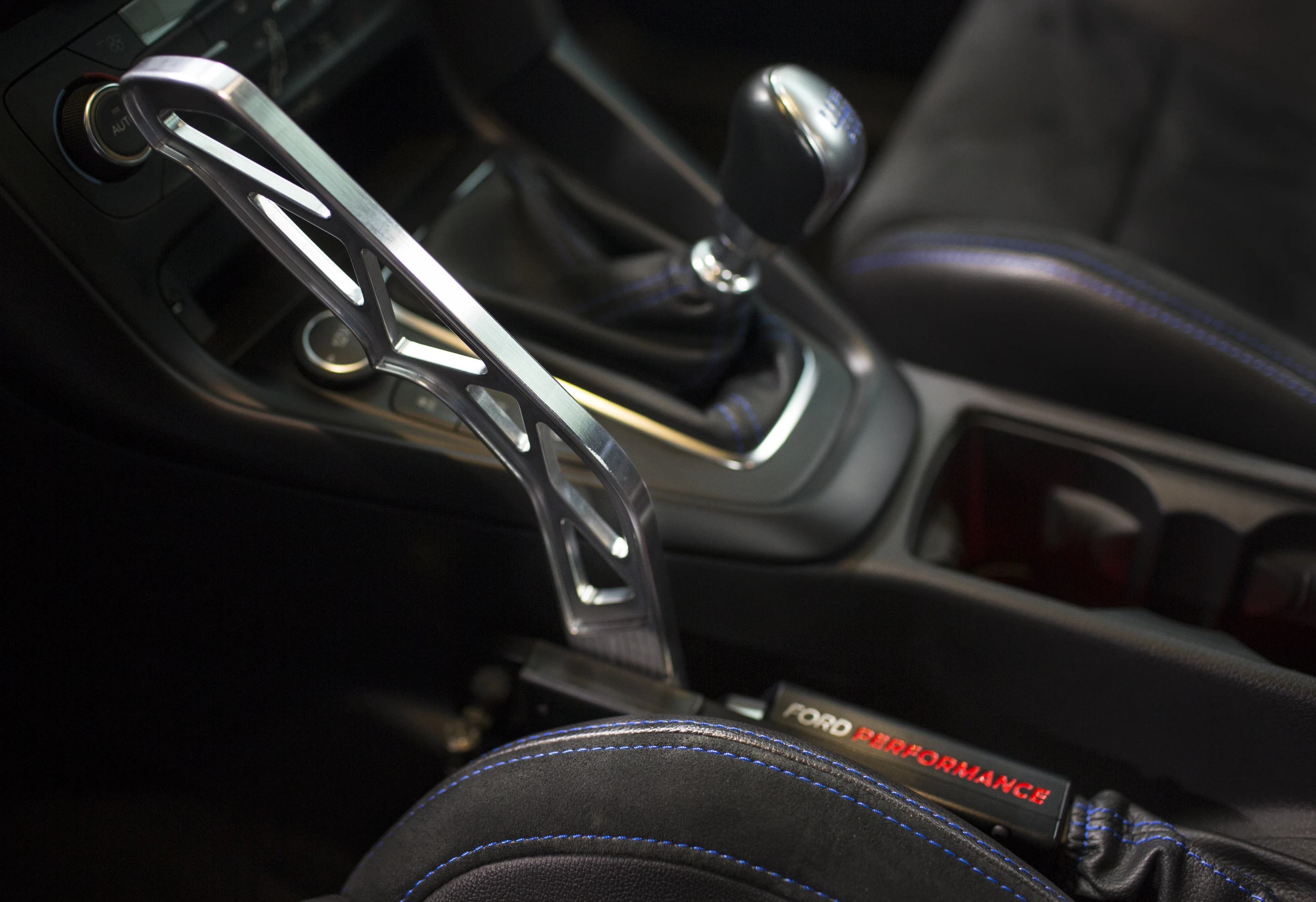 The "Stick" part of the Drift Stick is an aluminum lever located between the driver's seat and the manual gearshift