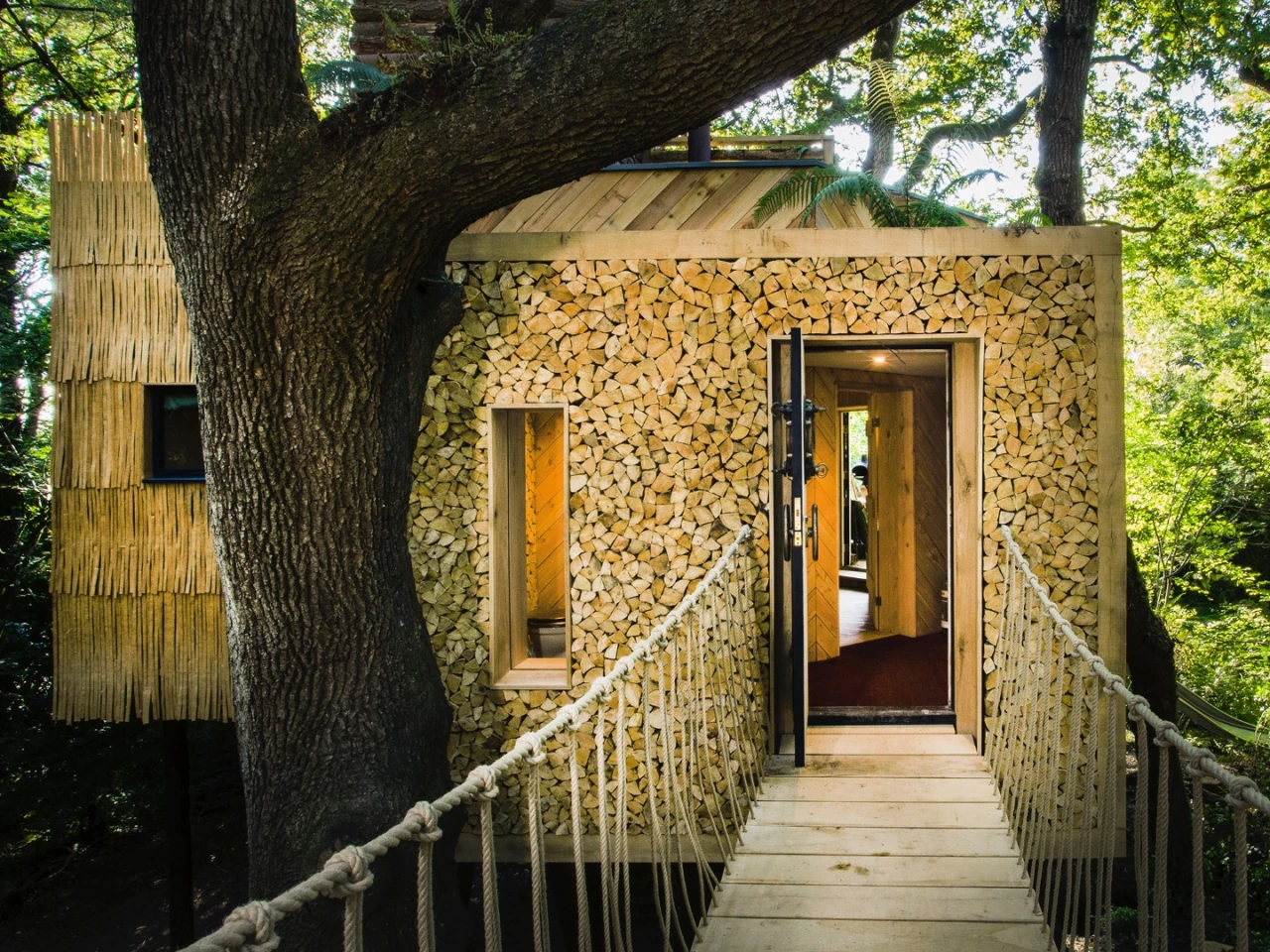 Woodsman's Treehouse is accessed by suspension bridge