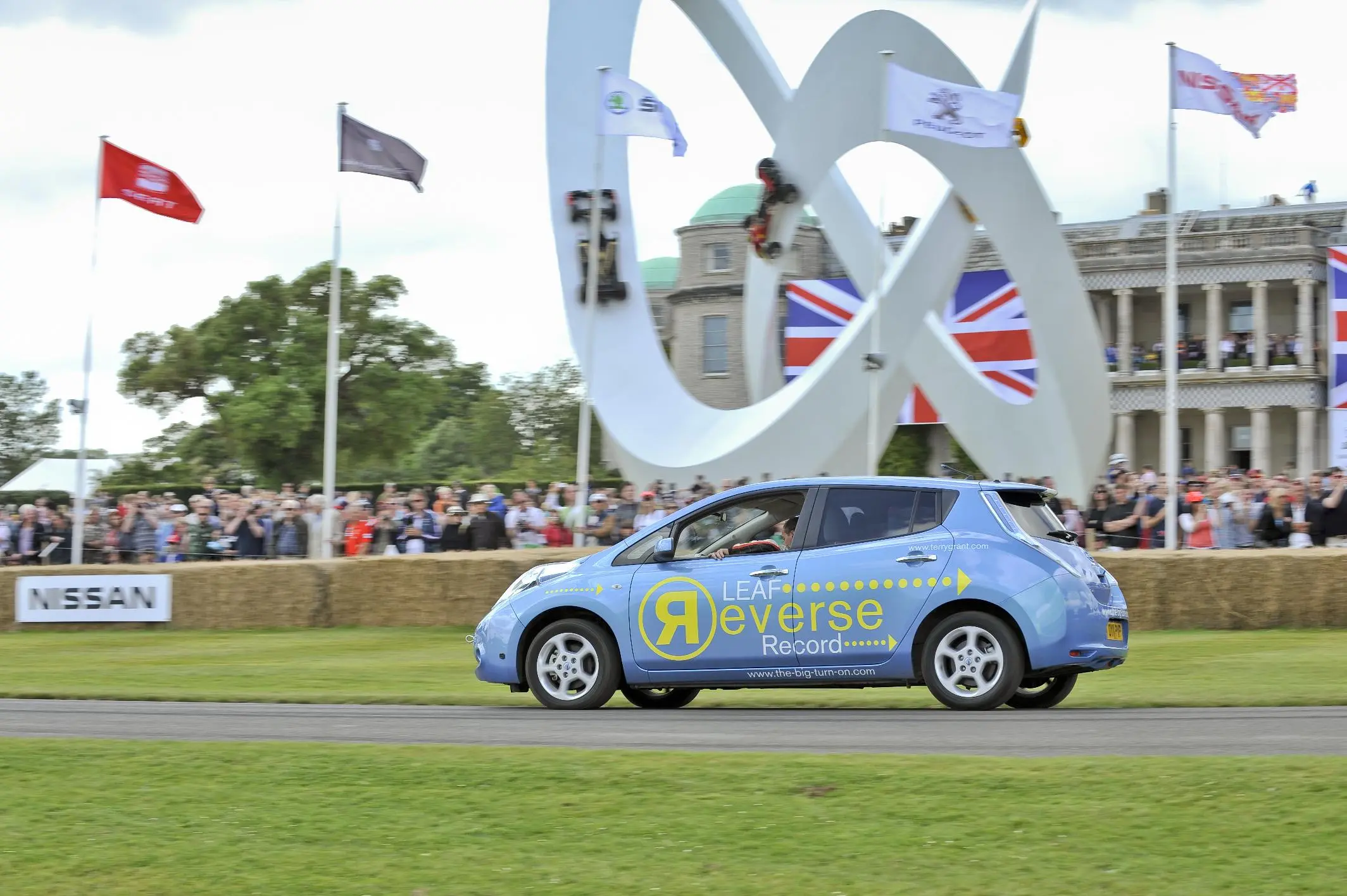 The Nissan LEAF covered 1 mile in 1m 37.02s at an average speed of 55 mph .. in reverse