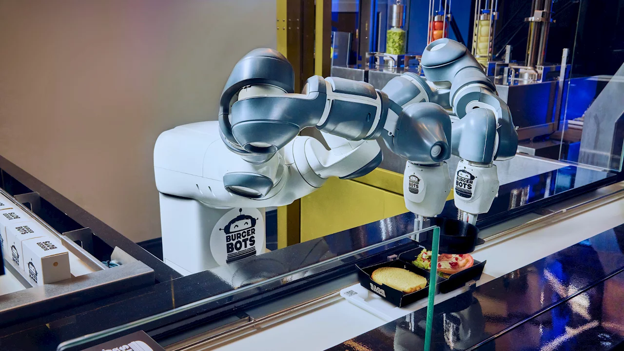 If you add cute graphics to a robot, it sure does make it seem like it's happy to be assembling your burger