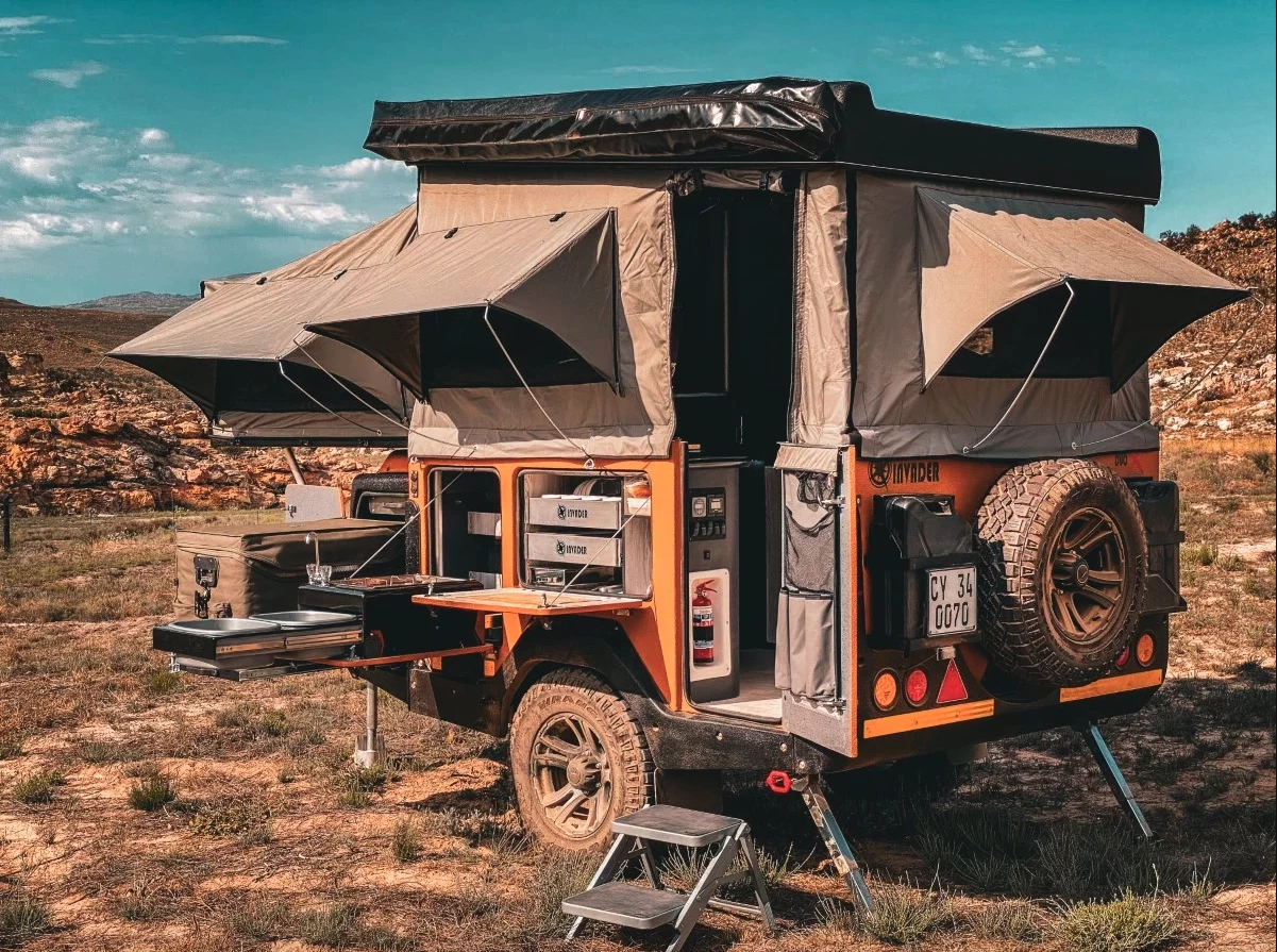 The Duo X's many sliding and folding expansions create an adventurous duplex with dedicated sleeping and cooking spaces and an indoor toilet