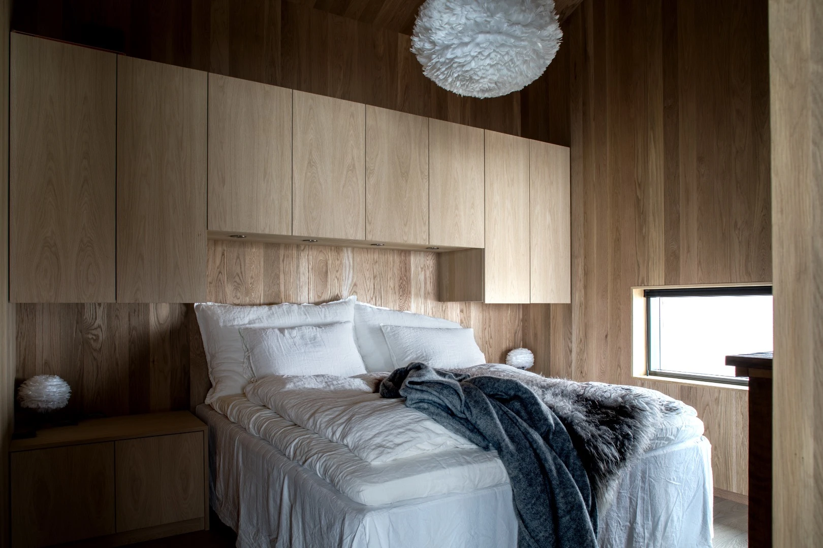 The Hooded Cabin's master bedroom is situated toward the back of the home