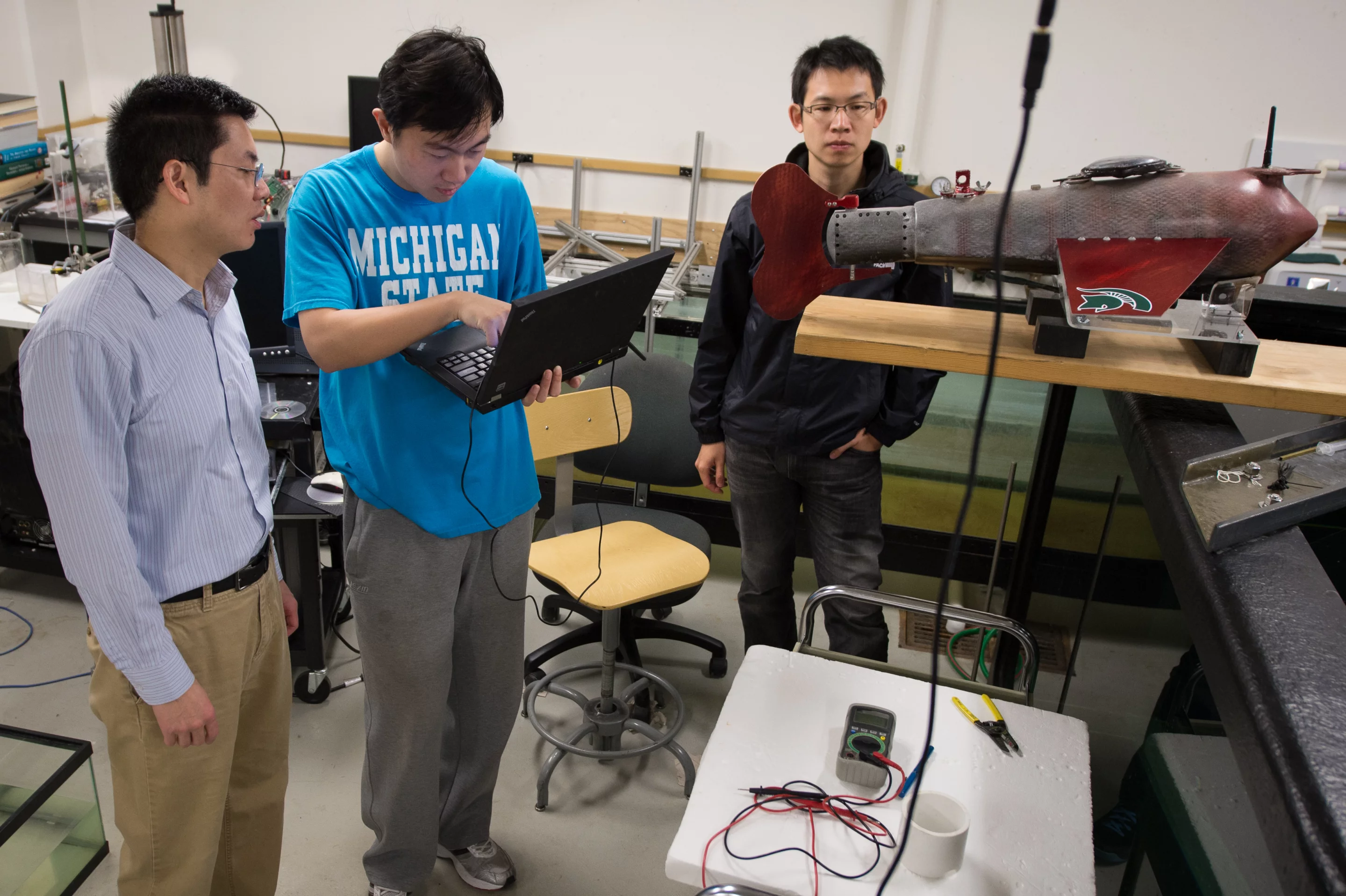 Students at MSU's Smart Microsystems Lab work on a robot fish called Grace (Photo: Xiaobo Tan)