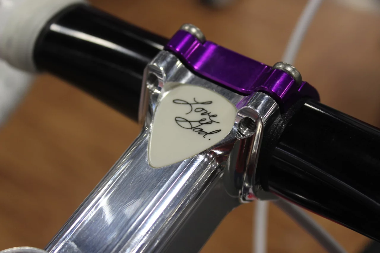 A guitar pick used by Prince is embedded in the stem