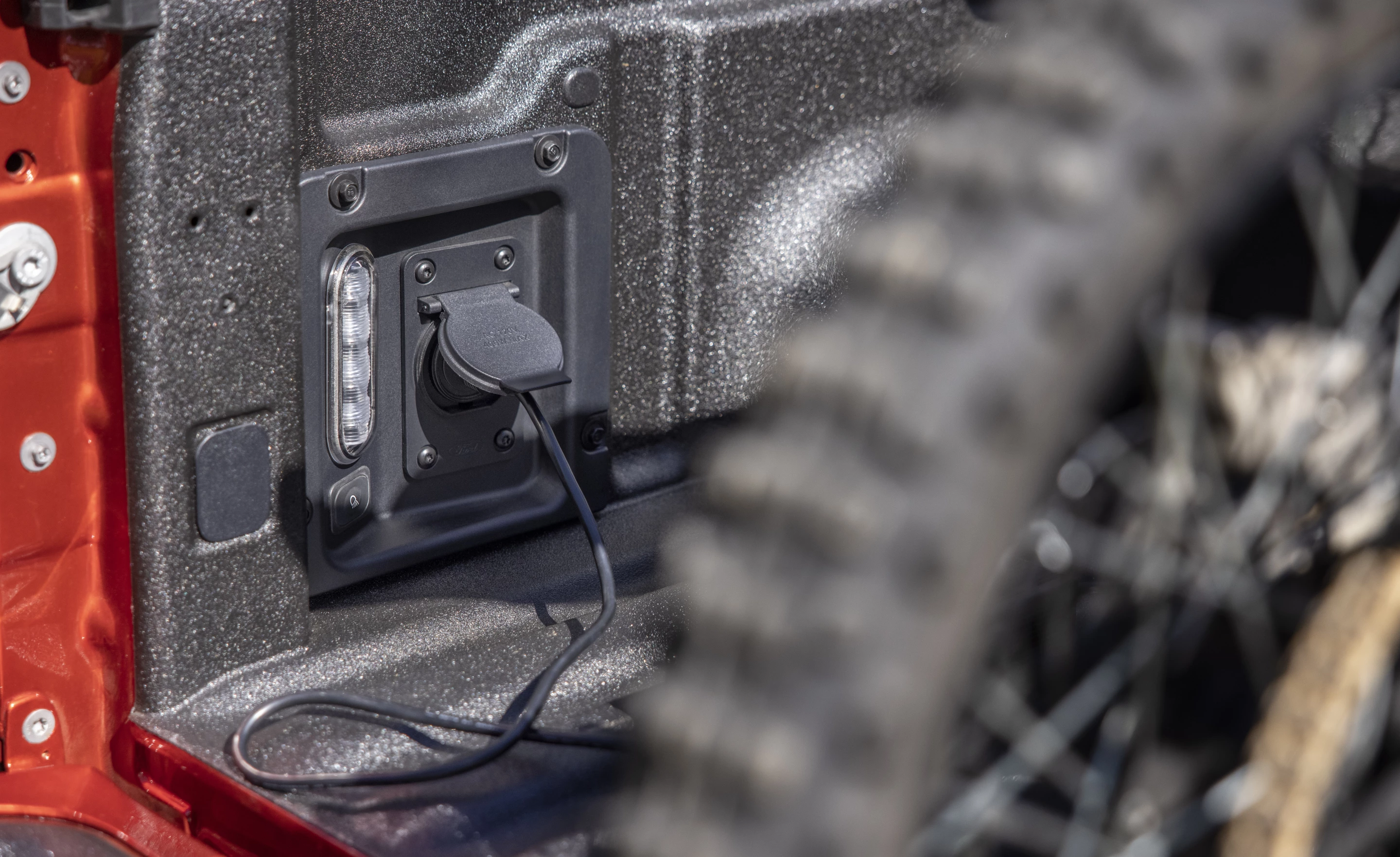 While the 12-volt outlet in the bed is standard on the Ford Maverick, a 110V outlet can also be added