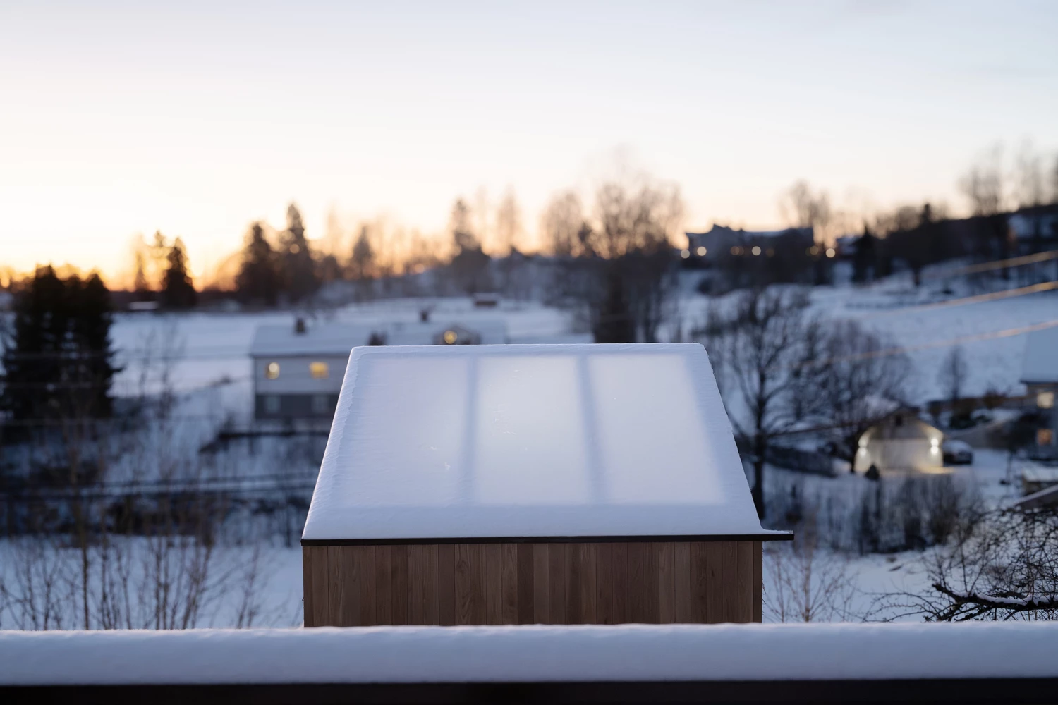 Oak tree branches frame the secluded lounge with its glass roof