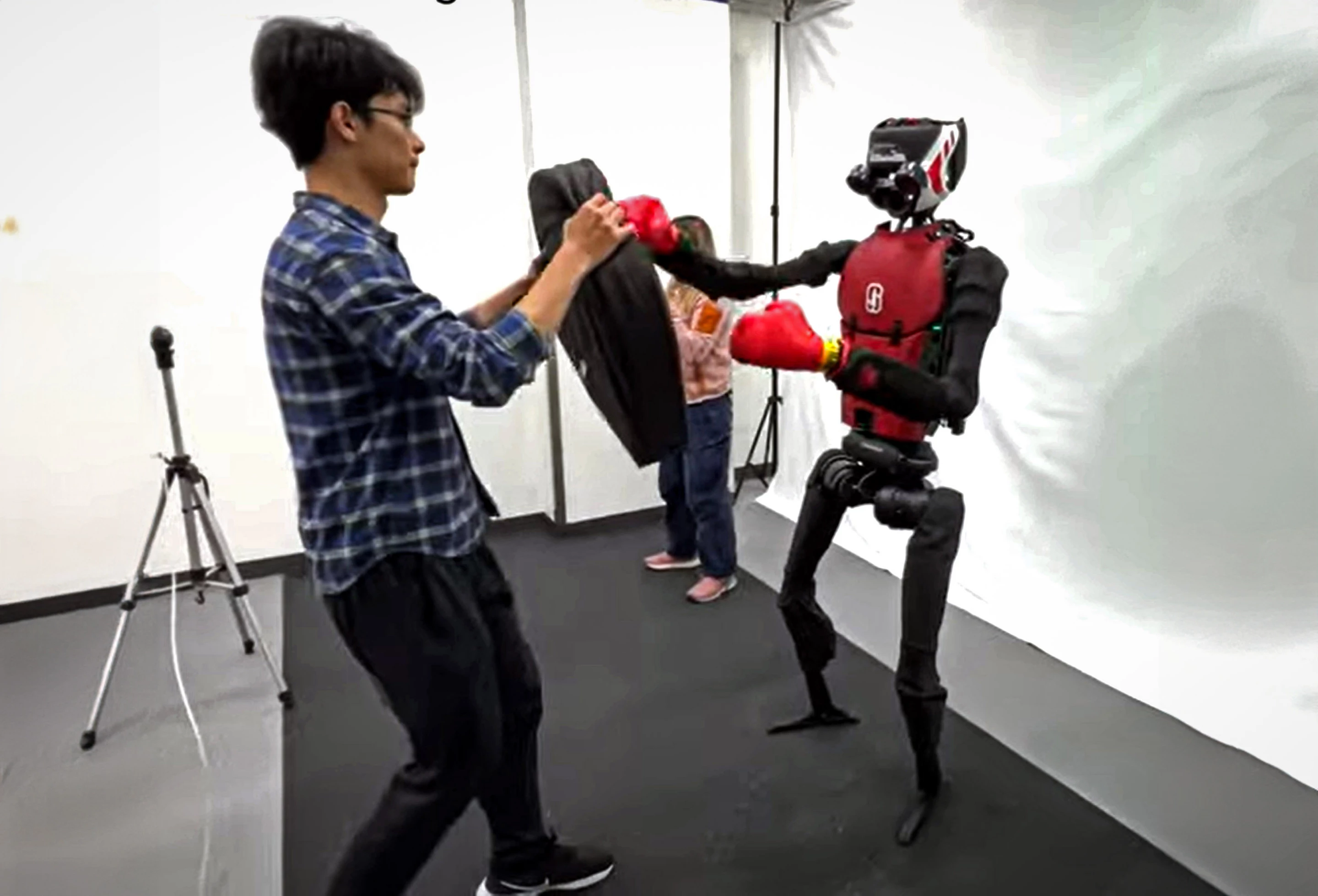 The HumanPlus, with a 0-0 record, lands a 1, 2 left, right punch
