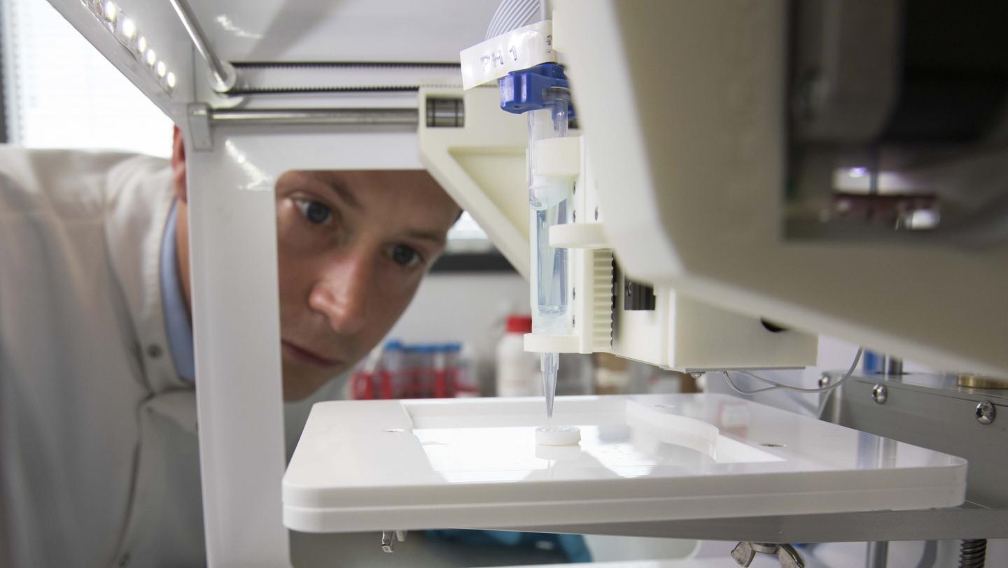 Dr. Steve Swioklo watches as a cornea is printed