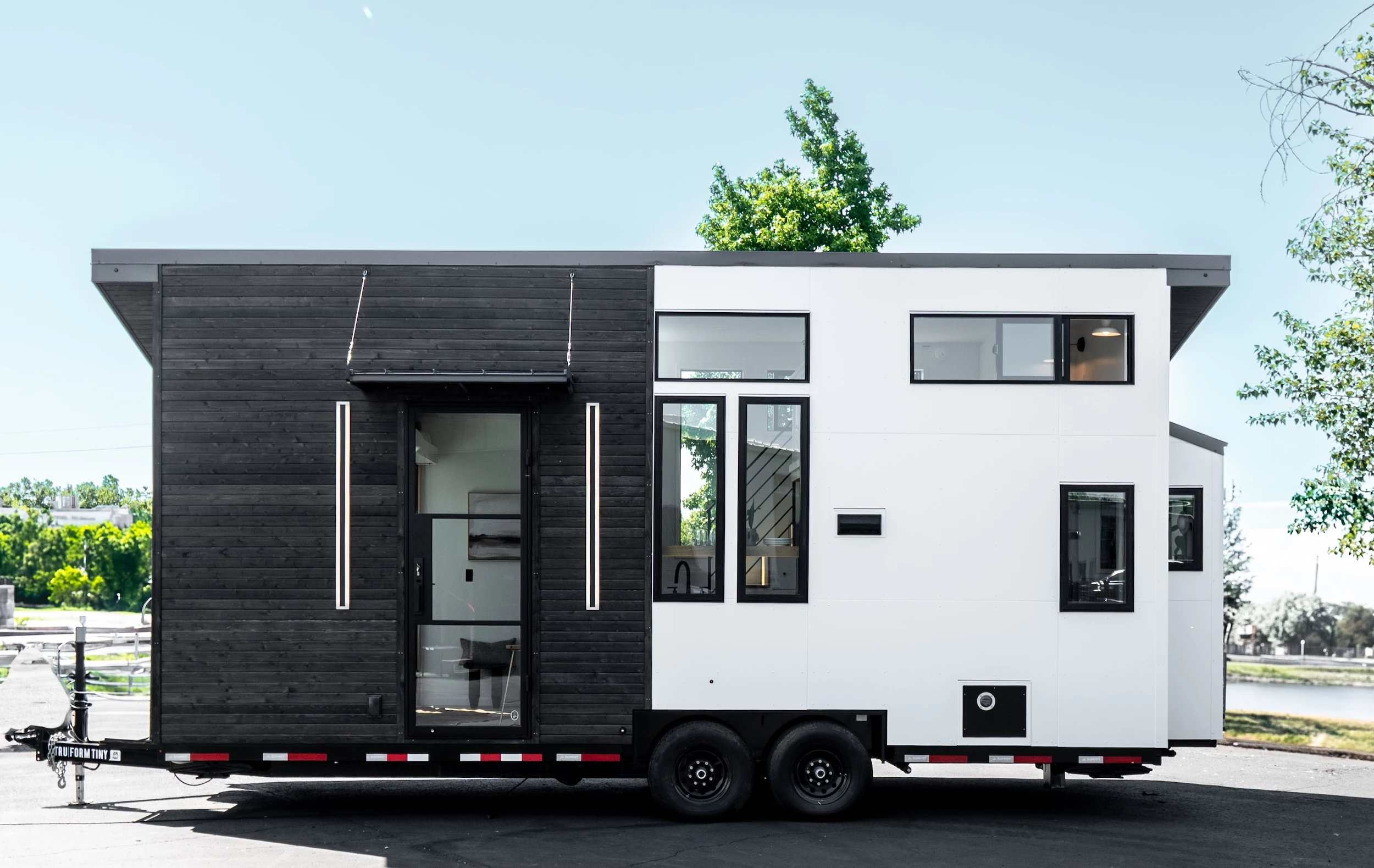 The Terra Urban is a modern tiny house that maximizes floorspace with an elevating bed