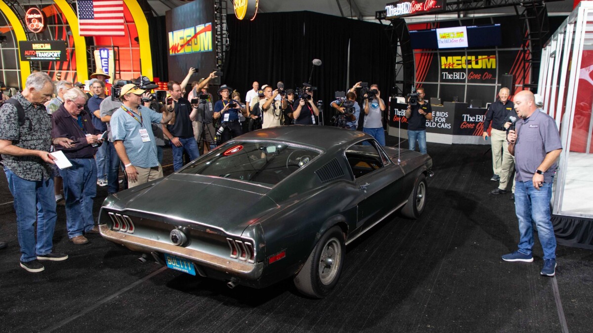 The Bullitt car's owner, Sean Kiernan (with microphone) during the announcement of the auction of the car at Mecum's Monterey 2019 auction earlier today