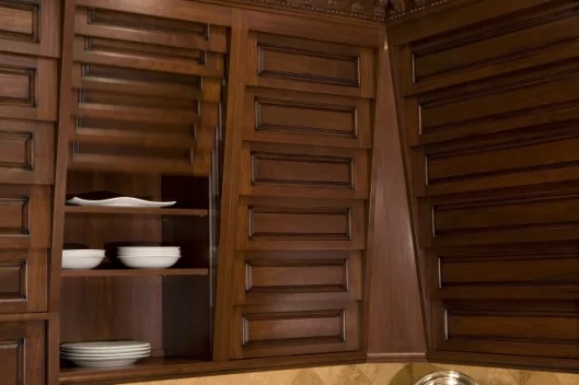 Cupboard doors slide vertically to reveal their contents