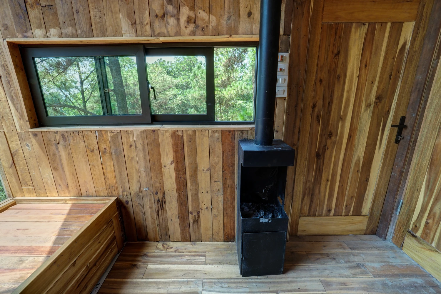 Log fire inside the Forest House