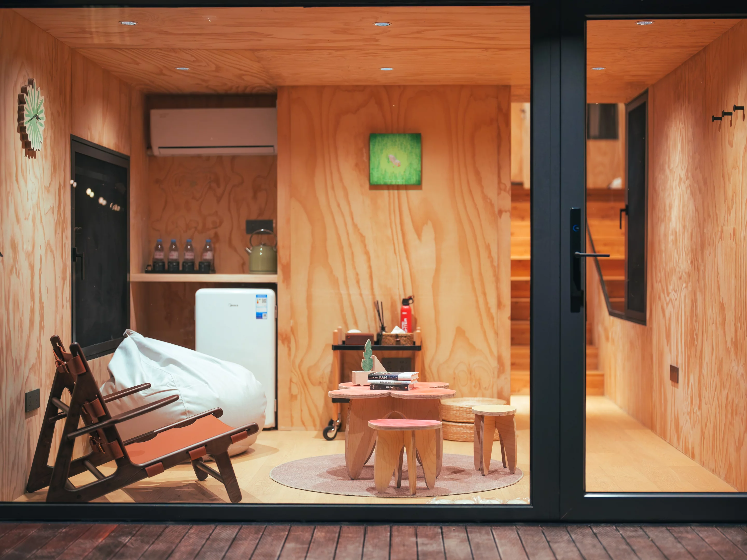 LED lighting highlights the natural wood grain of the structures