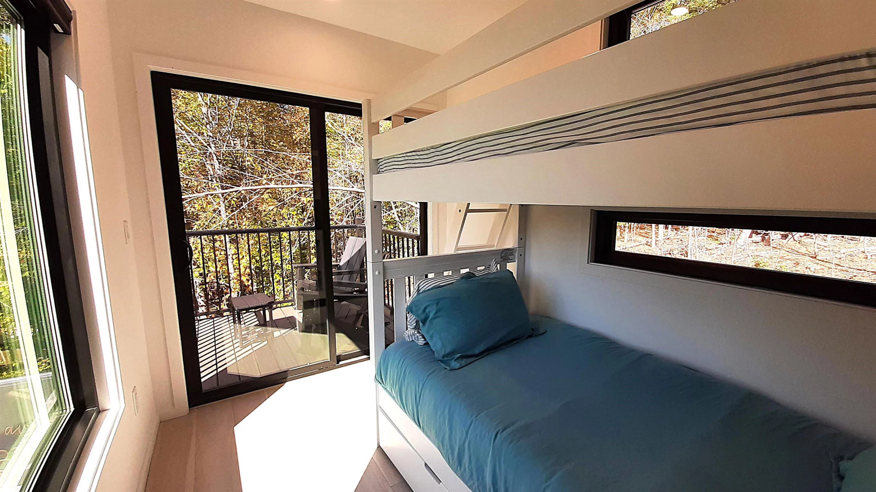 The Vermont Villa's secondary bedroom has bunkbeds and its own terrace area