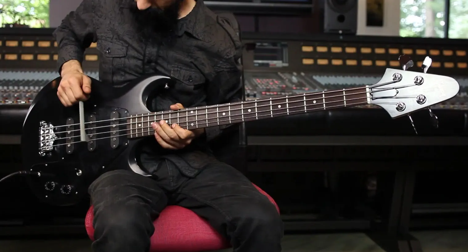 Creator Alex Bodnar playing bass with the Guitar Triller