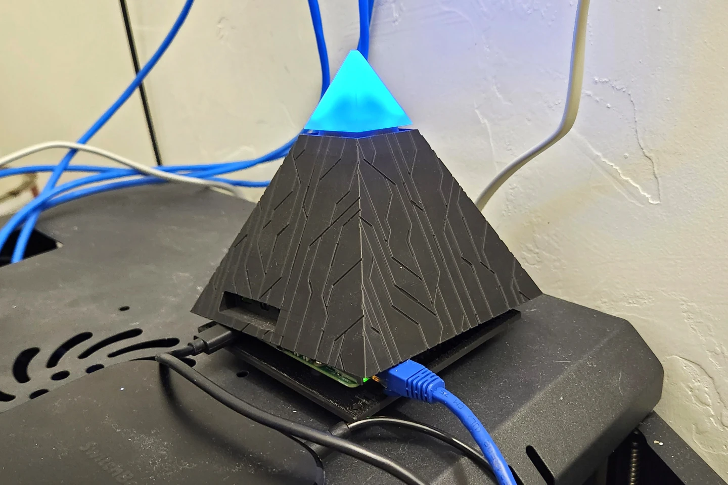 The Intern lives atop my server rack, ever glowing in the dark. I did pop the case apart so I could plug in Ethernet so it could have those FiOS speeds