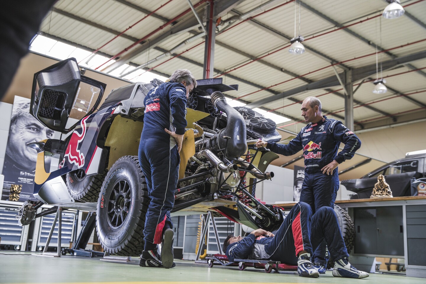 Carlos Sainz (far left) says, "the new Peugeot 3008DKR Maxi felt good in testing it and it’s definitely an improvement over the previous one: I feel we’ve made some steps forward. The main change is obviously a wider track, which should allow us to push a bit more in the corners, and the car also feels more stable on fast and rough gravel roads.
