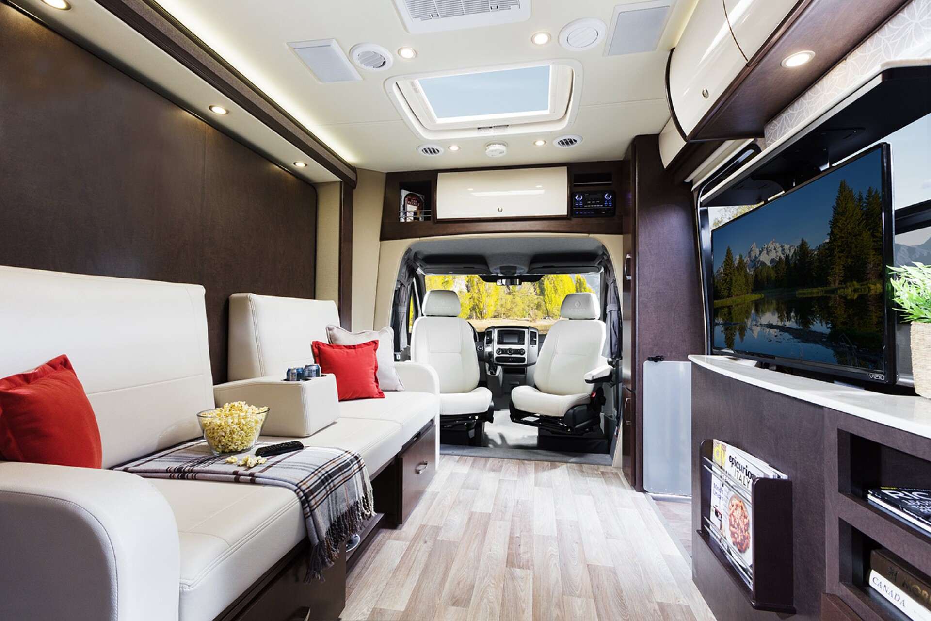 Unity motorhome combines Murphy bed and swivel recliners in comfy