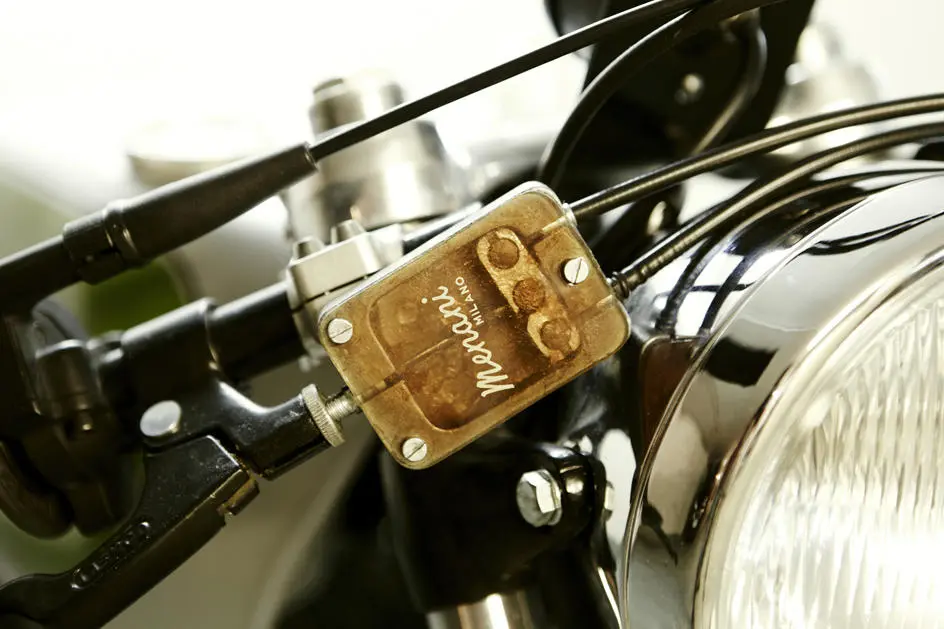 The front drum brake has arms on both sides, so this simple splitter mechanism connects them both to the brake lever