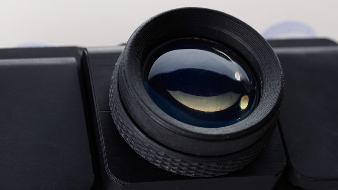 The lens is 3D-printed using a Formlabs SLA printer and clear resin, with some polishing