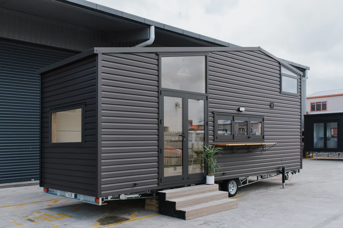 The Hilltop Tiny House features a steel frame and is finished in vinyl cladding