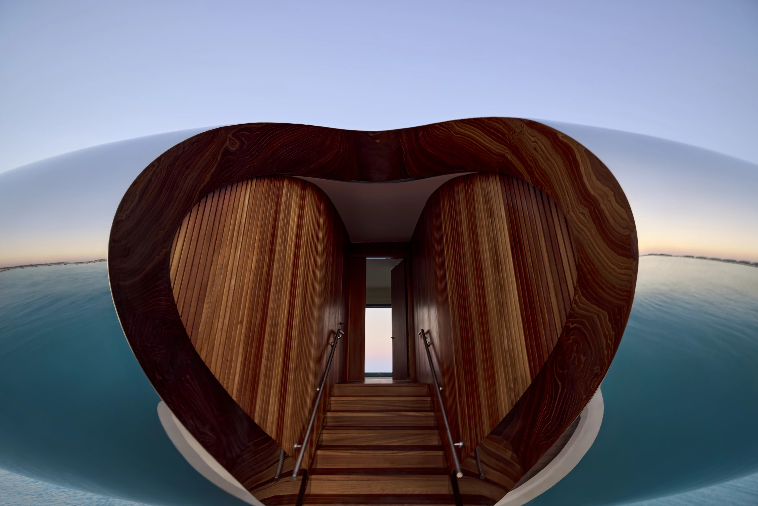 Shebara Resort's exteriors are finished in mirrored stainless steel, while the interiors are warmer and include wood and neutral tones