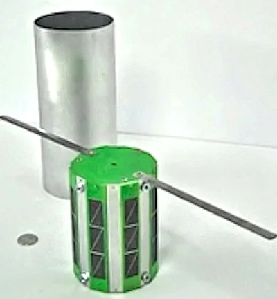 An Interorbital Systems Tubesat showing its antennas and solar cells next to its ejection chamber