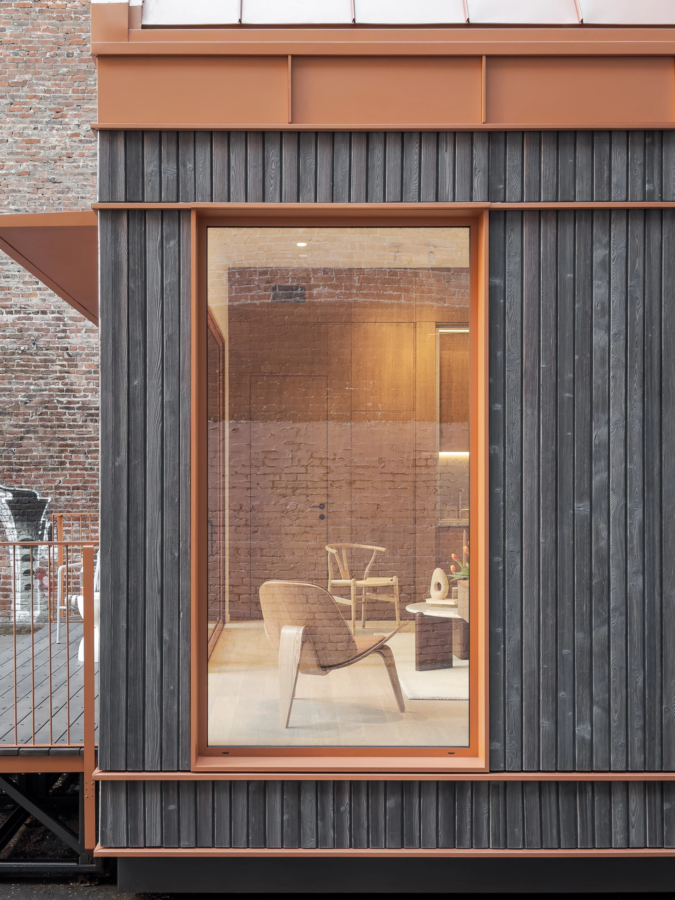 The Cosmic One is finished in either aluminum panels or charred wood, with a stainless steel roof