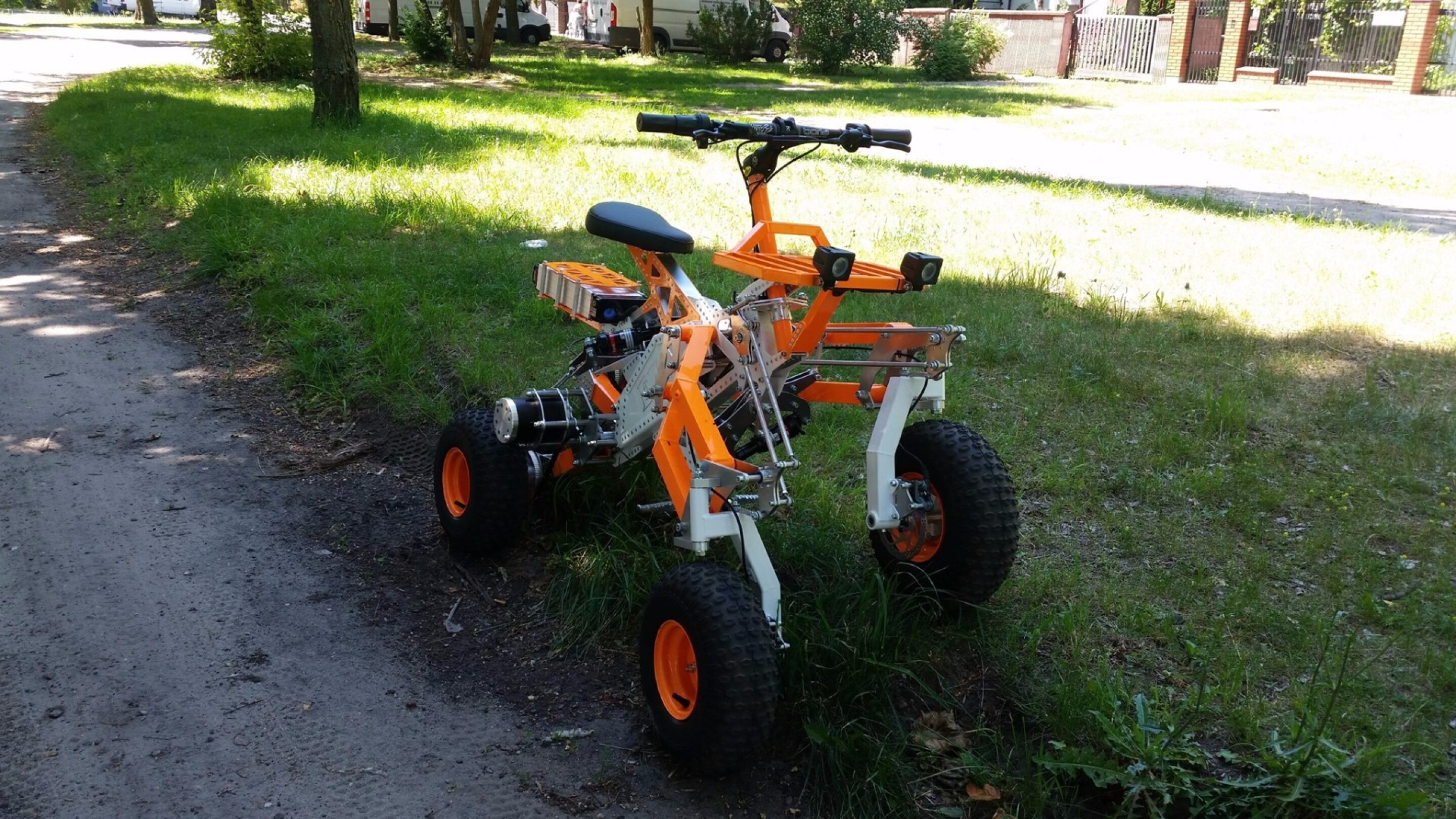 Tilting electric quad gets menacing offroad big brother