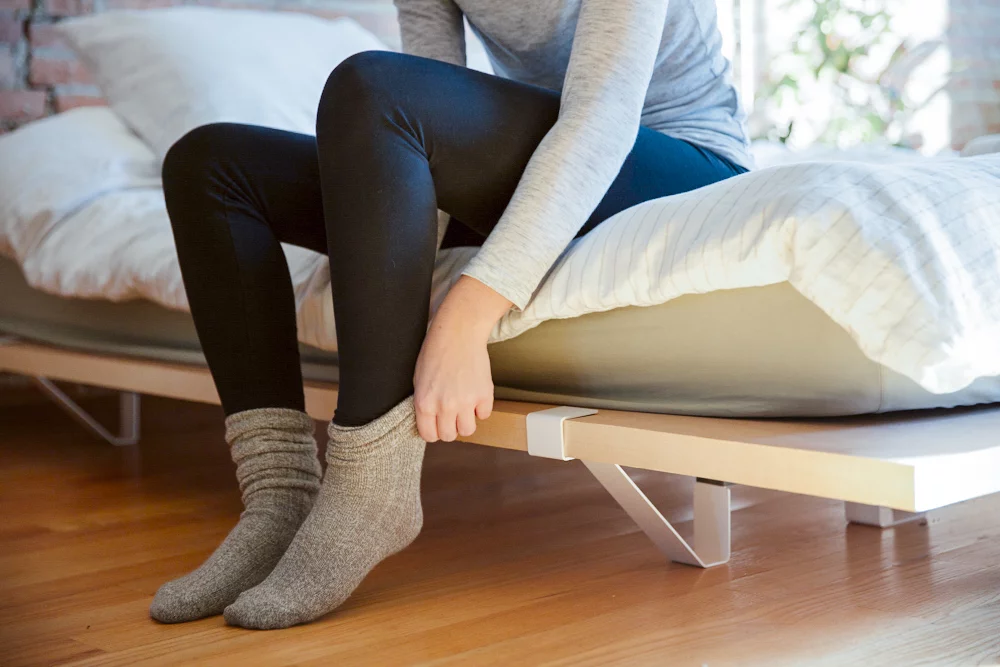 The steel supports slot onto the panels to raise the panels off the floor