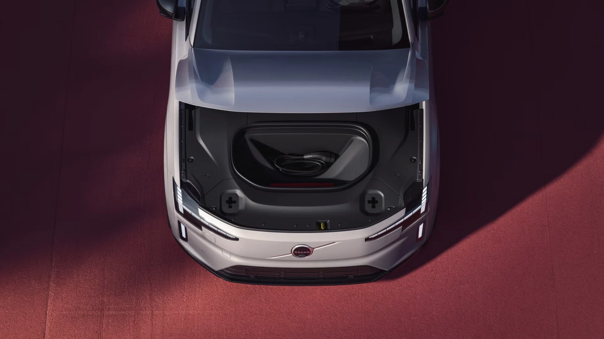 The frunk offers 0.7 cubic feet (22 L) of room to store charging cords